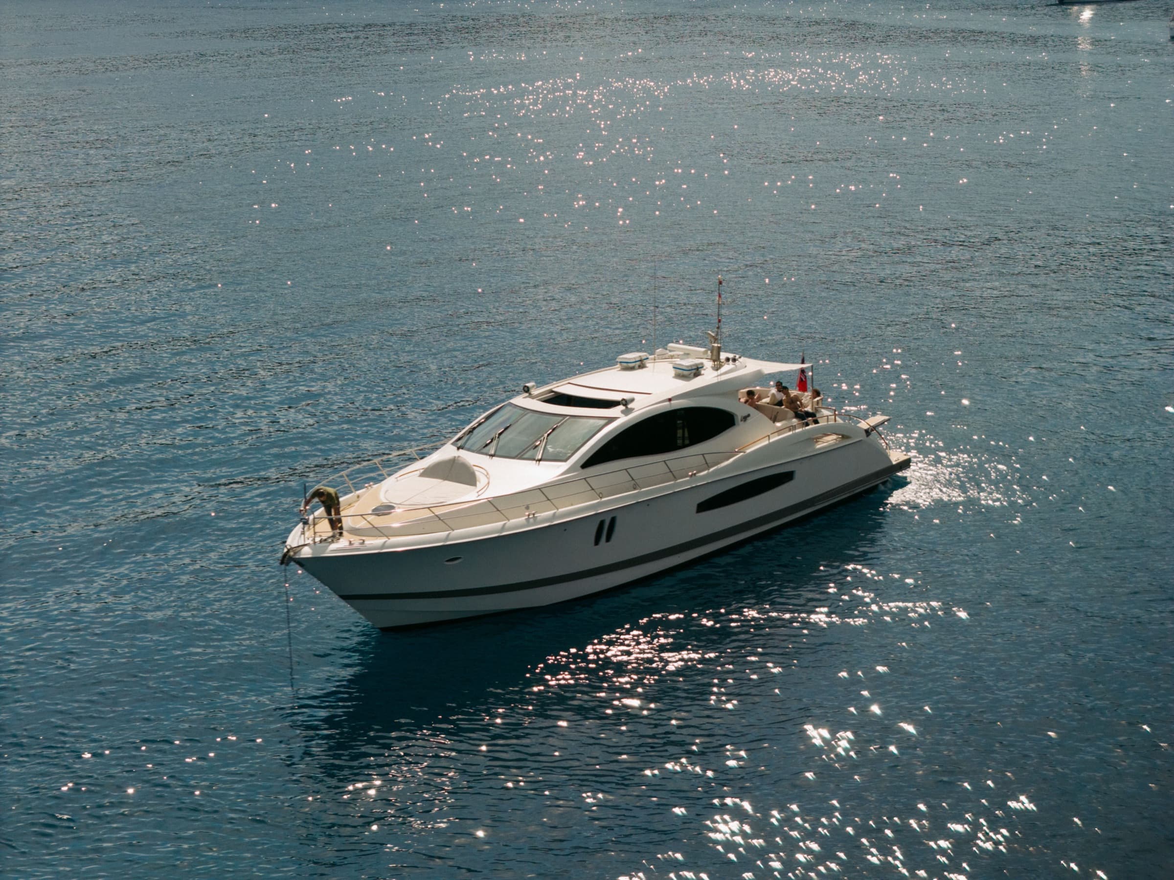 Aerial profile of Sans Regret cutting through Mediterranean blue