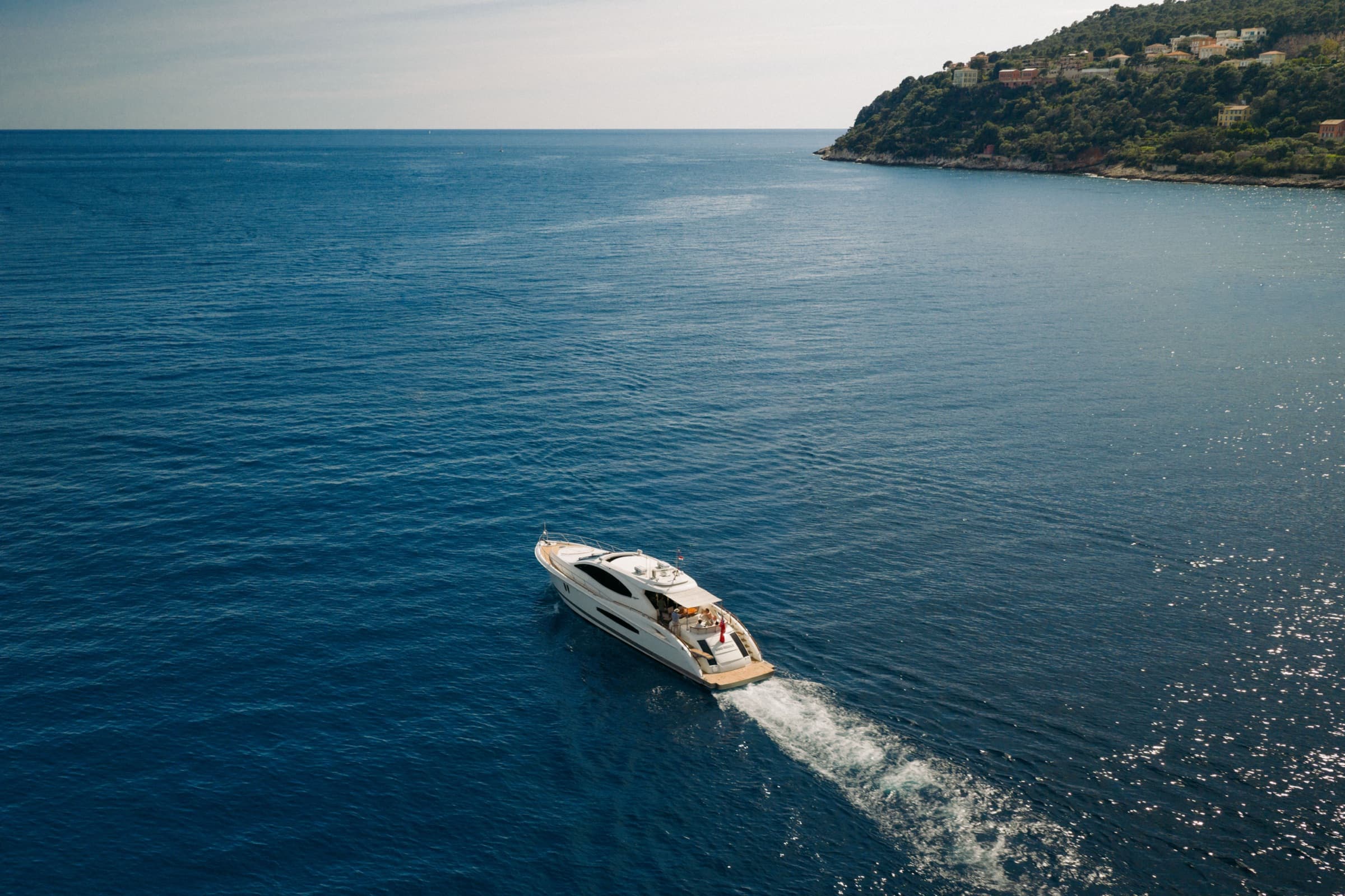 Drone perspective of Sans Regret on a calm sea
