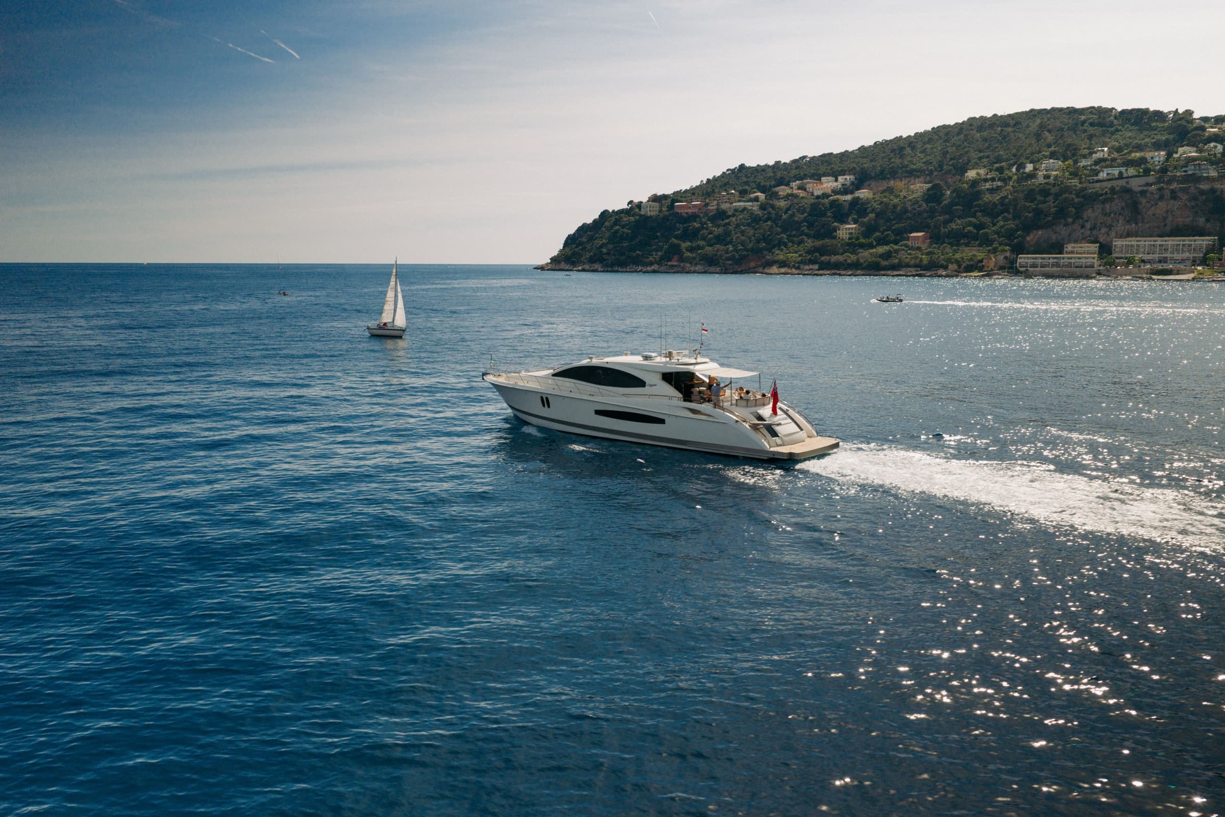 Aerial view of Sans Regret with tender alongside