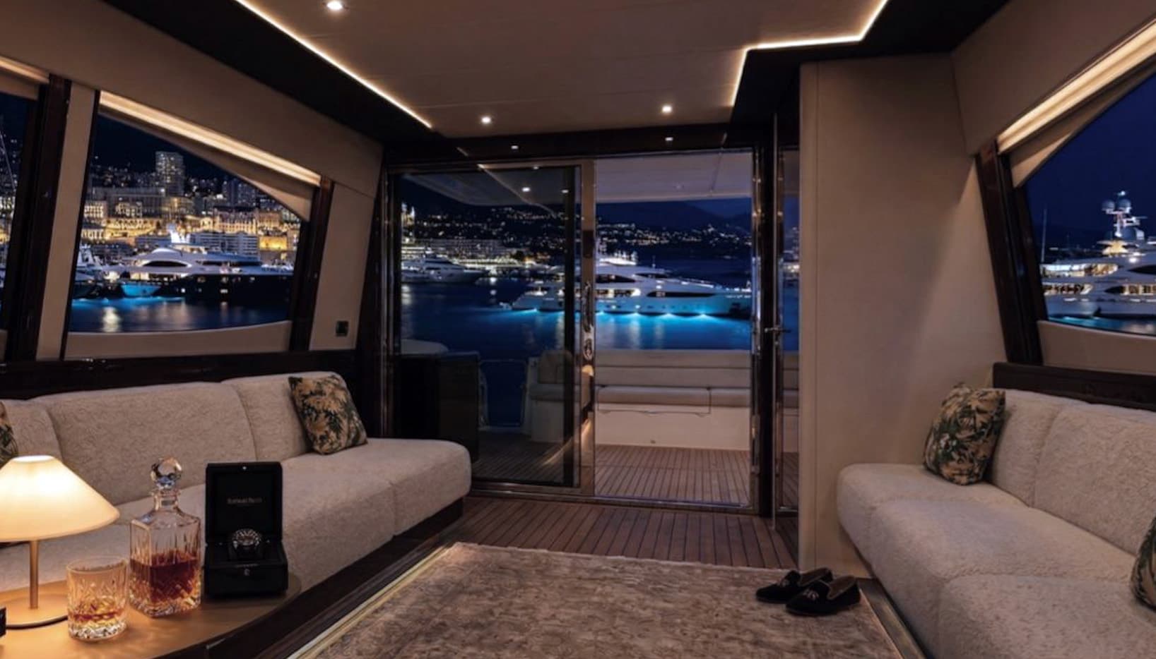 Salon at night with Monaco harbour views
